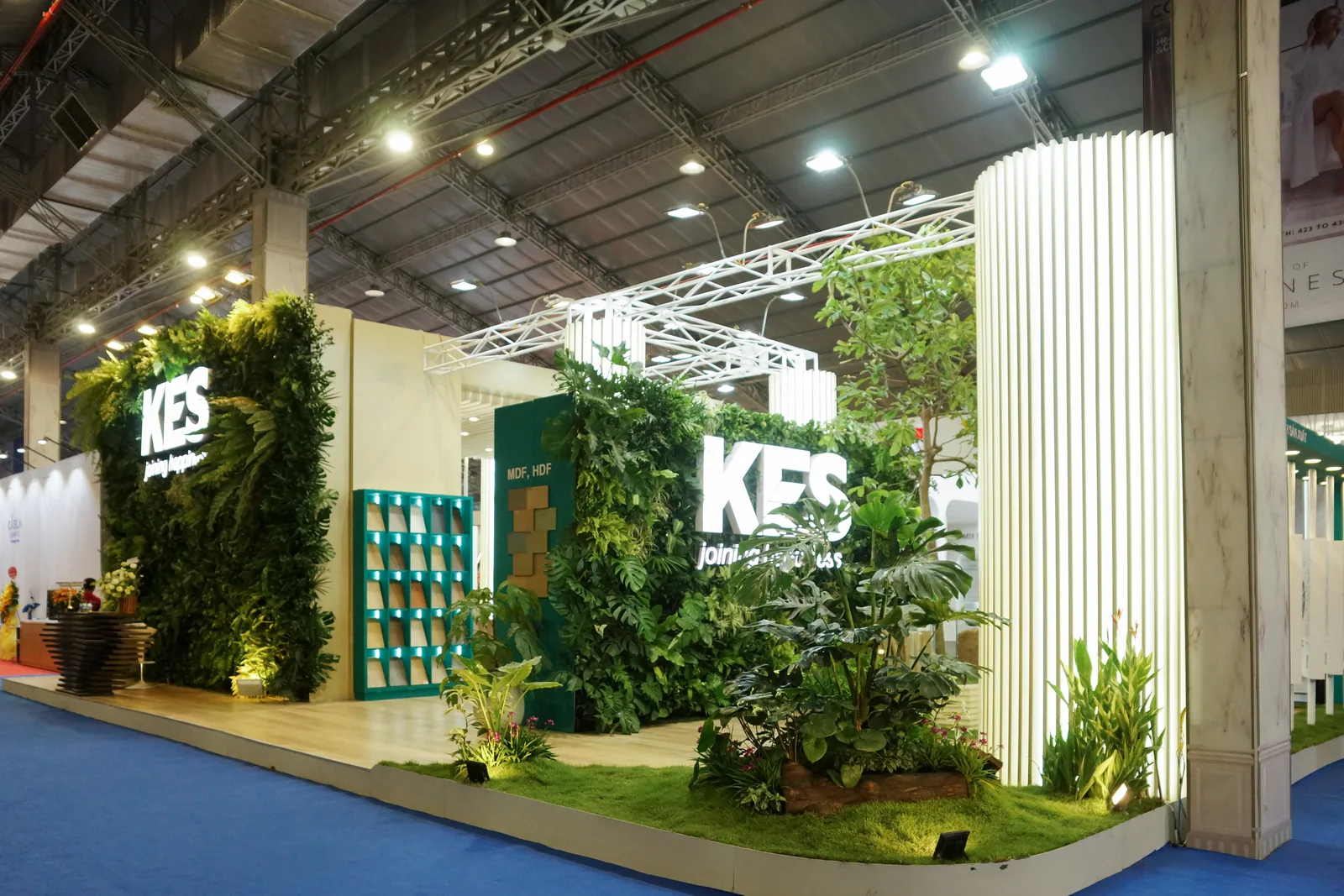 Wide view of the KES exhibition green wall inside the Vietbuild hall
