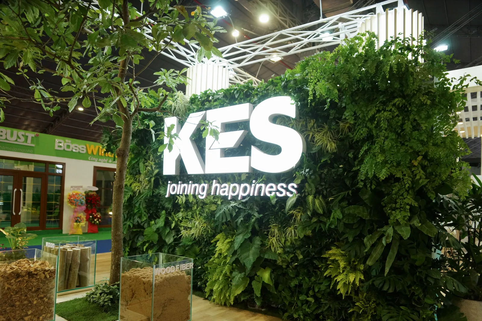 KES exhibition green wall with an illuminated logo over live foliage