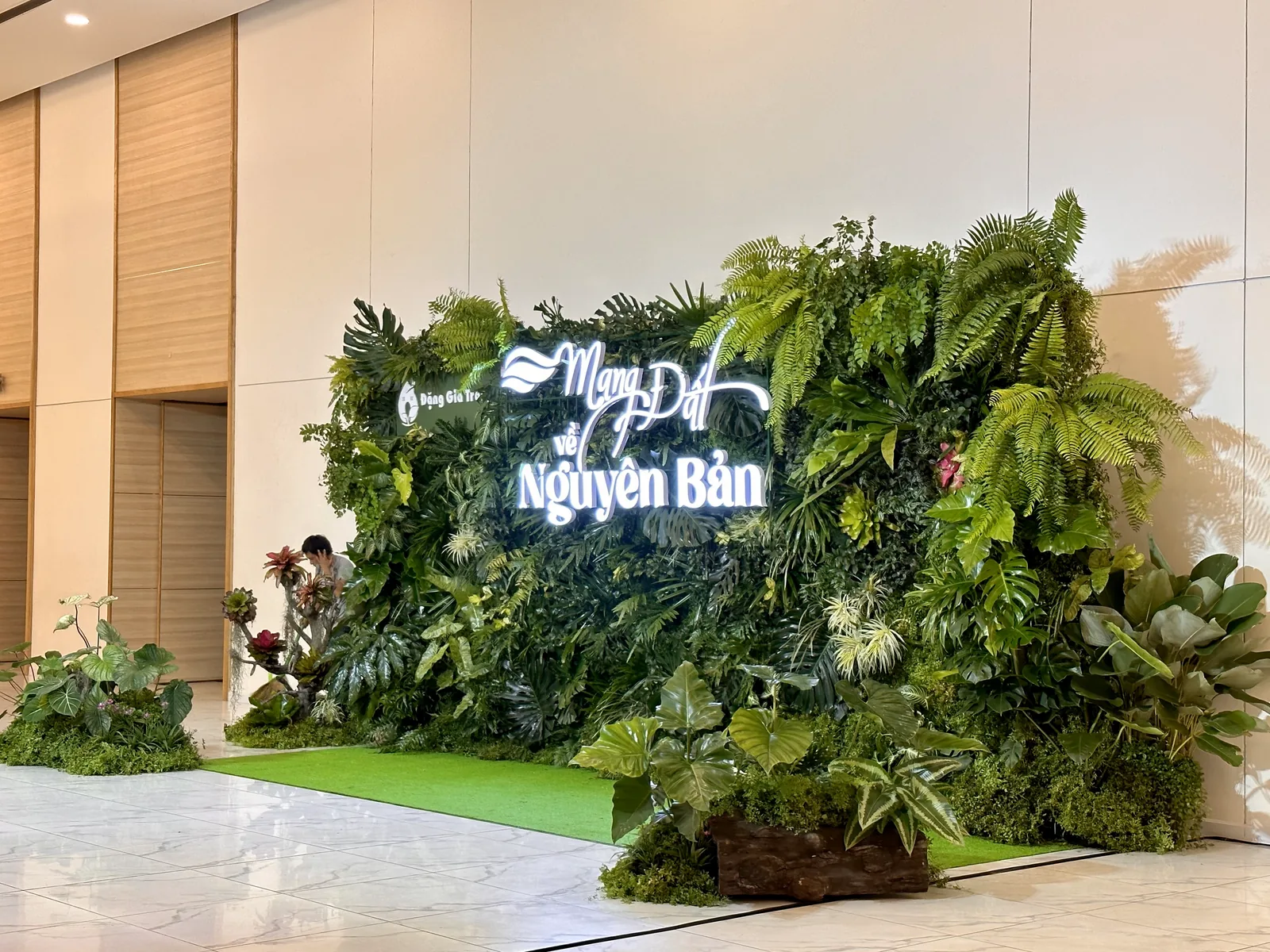 Wide view of the completed Dang Gia Trang anniversary green wall